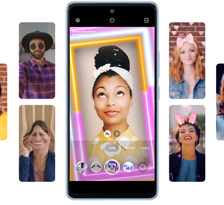 Numerous screens of the Galaxy A53 5G, with the one at the center being the largest and showing a woman using the Moving Neon Frame, shows several other people using Fun mode to try on different Snapchat Lenses that are applying various filters onto their faces and background. The other users are using filters that add the following effects to the user's facial features and background: Cowboy hats, black sunglasses and a black beard, comically enlarging one's mouth sideways, white and pink hearts in the background as well as a pink ribbon headband, pink bunny ears and sparkling lights in the background, and more.