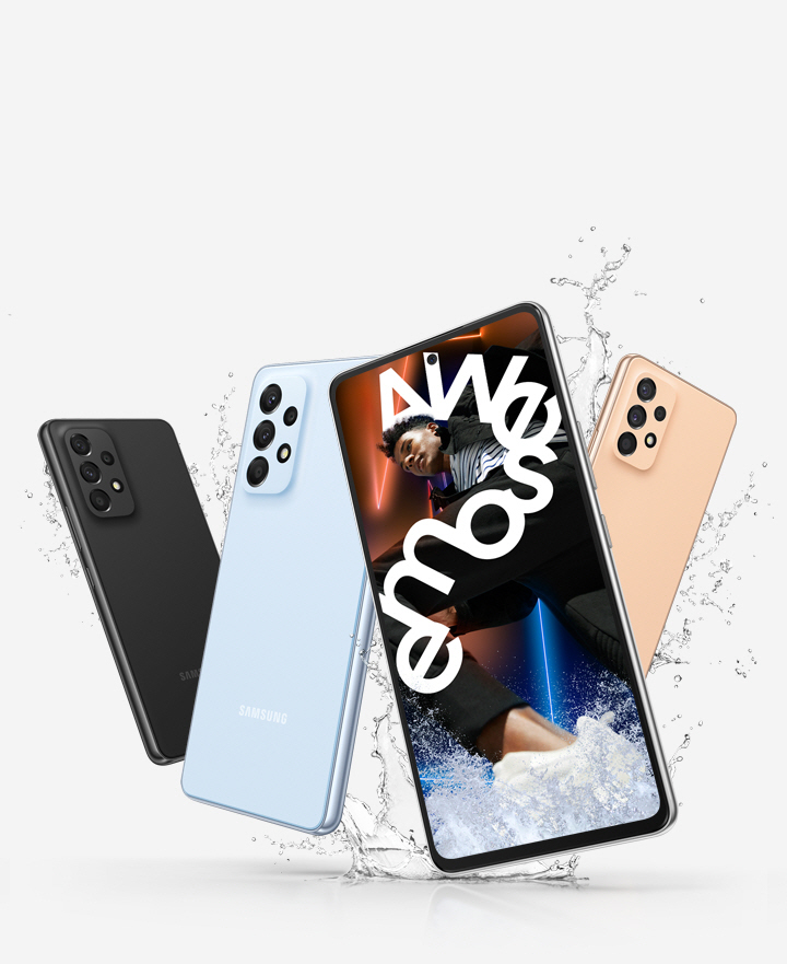 Four Galaxy A53 5G devices are shown with three of them showing the backside to display the Awesome Black, Awesome Blue and Awesome Peach colorways and a single front-facing Galaxy A53 5G shows a vivid picture of a man who is wrapped in white text reading Awesome.