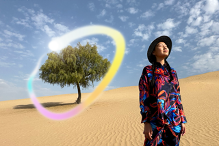 iPad Pro, front exterior display with dark blue and green gradient background with multiple apps open, hand holding Apple Pencil Pro circling a sketch showing Apple Intelligence Image Wand feature